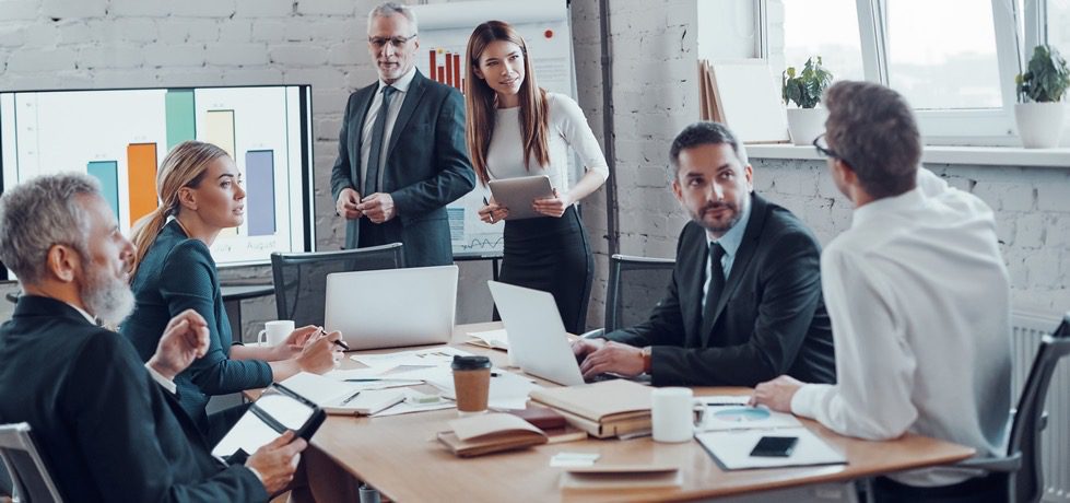 Successful,Business,Professionals,Presenting,Analytical,Report,While,Working,Together,With